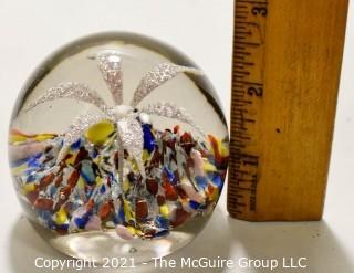 Vintage Round Hand Blown Lampwork Glass Paperweight with White Flower. Measures 3" in diameter.