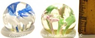 Two (2) Vintage Round Hand Blown Lampwork Glass Paperweights with Blue & Green Flowers. Measures 2" in diameter.