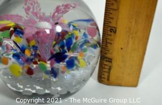 Vintage Round Hand Blown Lampwork Glass Paperweight with Pink Flower. Measures 3" in diameter.