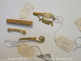 Collection including pins and tie clasps 