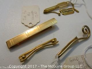 Collection including pins and tie clasps 