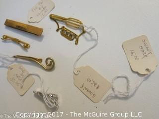 Collection including pins and tie clasps 