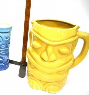 Seven (7) Tiki Mugs Or Tumblers with Pitcher in Blue and Yellow.  Includes two (2) Virginia Distillery Mugs and one (1) Luau Hut cup. Barware. 