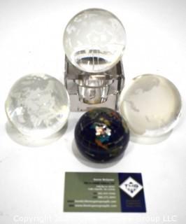 Group of Four (4) World Globe Paperweights Made of Etched Crystal and Enamel Painted Metal.  
































