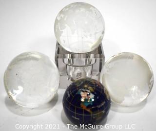 Group of Four (4) World Globe Paperweights Made of Etched Crystal and Enamel Painted Metal.  
































