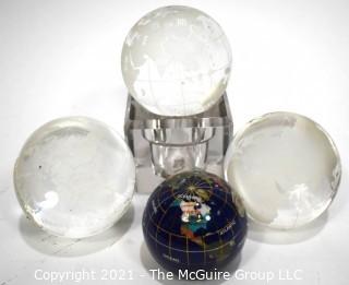 Group of Four (4) World Globe Paperweights Made of Etched Crystal and Enamel Painted Metal.  
































