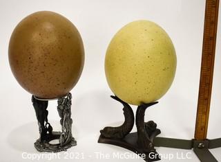 TWo (2) Faux Decorative Ostrich Eggs on Stands. 