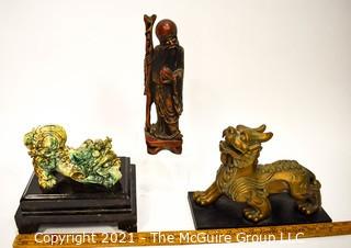 Three (3) Asian Statues Including Ceramic & Metal Foo Dog & Carved Elder. 