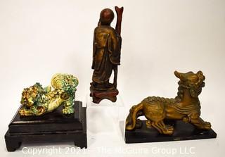 Three (3) Asian Statues Including Ceramic & Metal Foo Dog & Carved Elder. 