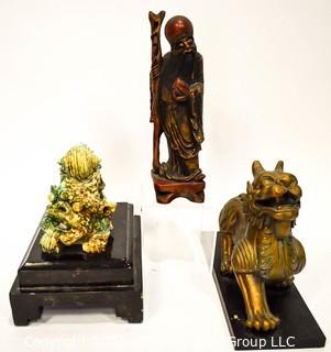 Three (3) Asian Statues Including Ceramic & Metal Foo Dog & Carved Elder. 