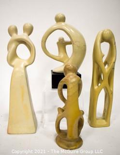 Four (4) Hand Carved Soapstone Sculptures of People Embracing 