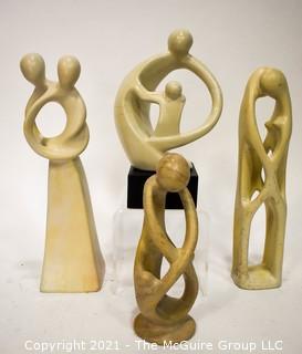 Four (4) Hand Carved Soapstone Sculptures of People Embracing 