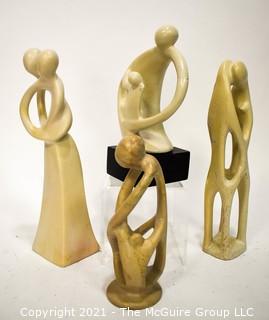 Four (4) Hand Carved Soapstone Sculptures of People Embracing 