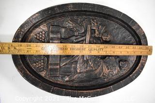 Heavy Cast Iron Oval Plaque of Monks in the Wine Cellar. 18" x 12".