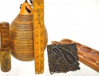 Four (4) Carved Wooden Items Including Batik Press, Mancala Games, Gourd and Mallet