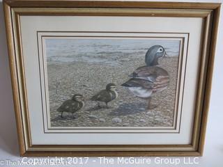 Framed print of geese on shoreline; signed; 19 x 24" 