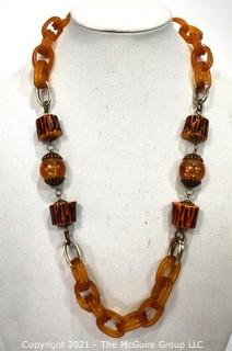 Vintage Apple Juice Bakelite Chain Link Necklace with Faux Wood Beads. Measures 29" long.