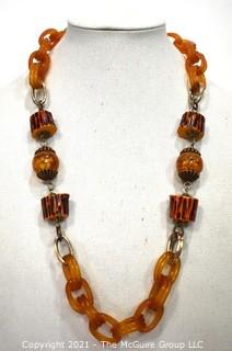 Vintage Apple Juice Bakelite Chain Link Necklace with Faux Wood Beads. Measures 29" long.