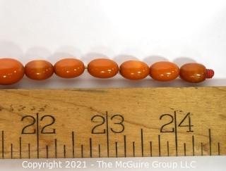 Mid Century Bakelite Art Deco Butterscotch Amber Bead Necklace in Geometric Shapes.  Measures 24" long.