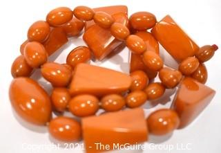 Mid Century Bakelite Art Deco Butterscotch Amber Bead Necklace in Geometric Shapes.  Measures 24" long.