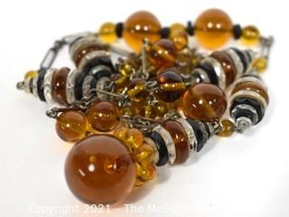 Vintage Art Deco Hand Blown Amber & Black Glass Drop Bead Necklace on Metal Chain with Pendant Center.  