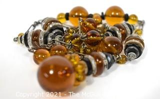 Vintage Art Deco Hand Blown Amber & Black Glass Drop Bead Necklace on Metal Chain with Pendant Center.  