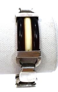 Vintage Root Beer and White Bakelite with Sterling Silver Link Bracelet. Weighs 54g