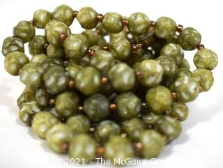 Vintage Opera Length Green & White Mottled Textured Beads with Screw Claps.  Measures 52" long.