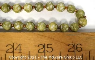 Vintage Opera Length Green & White Mottled Textured Beads with Screw Claps.  Measures 52" long.