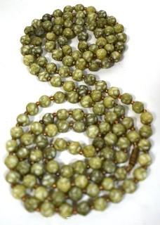 Vintage Opera Length Green & White Mottled Textured Beads with Screw Claps.  Measures 52" long.