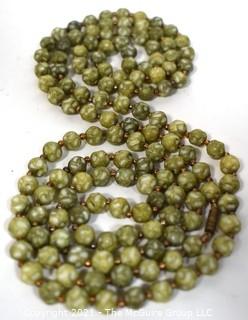 Vintage Opera Length Green & White Mottled Textured Beads with Screw Claps.  Measures 52" long.