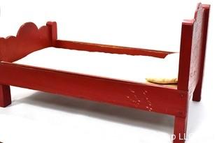 Antique Primitive Hand Made Red Painted Doll Bed.  Measures 24" x 14" x 13".