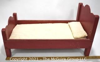 Antique Primitive Hand Made Red Painted Doll Bed.  Measures 24" x 14" x 13".