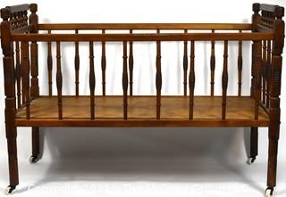 Antique Mahoghany Spindle Baby Bed.  Measures 36" x 19" x 25"