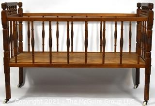 Antique Mahoghany Spindle Baby Bed.  Measures 36" x 19" x 25"