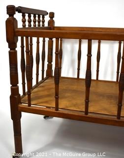 Antique Mahoghany Spindle Baby Bed.  Measures 36" x 19" x 25"