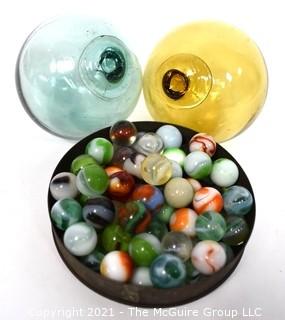 Two (2) Hand Blown Glass Fishing Net Floats and Group of Vintage Marbles. 