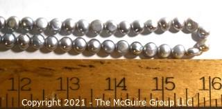 Opera Length Grey Freshwater Coin Pearl Necklace with 14k Gold Clasp.  Measures 32" long.  