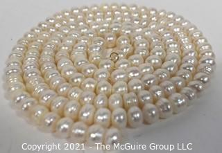 Strand of White Potato Round Freshwater Pearls.  Measures 48" long. 