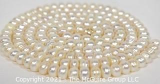 Strand of White Potato Round Freshwater Pearls.  Measures 48" long. 