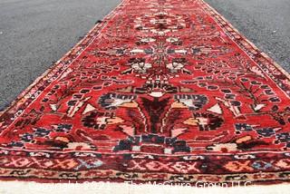 Hand Woven Persian Wool Runner Rug with Botanical Design on Red Ground. Measures 42" x 125"