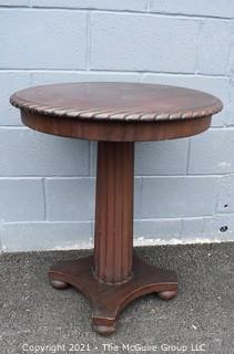 Vintage Round Pedestal Table with Spiral Carved Edge. Measures 24" D x 29" T.