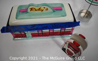 Three Piece Set of Ruby's Roadside Diner Decorative Items Including Cookie Jar, Straw Dispenser and Napkin Holder.   