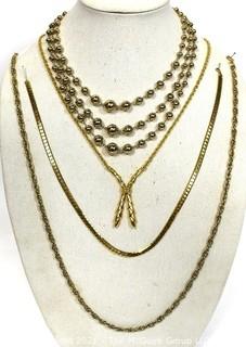 Four Pieces of Gold Tone Costume Jewelry Necklaces. 