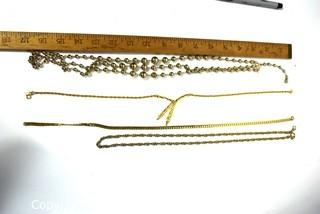 Four Pieces of Gold Tone Costume Jewelry Necklaces. 