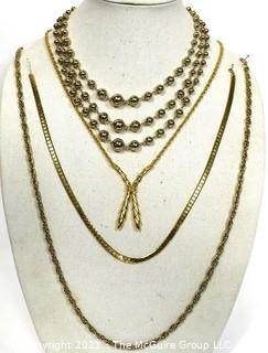 Four Pieces of Gold Tone Costume Jewelry Necklaces. 