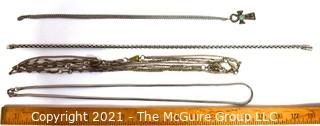 Four Pieces of Silver Tone Costume Jewelry Necklaces.
