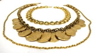 Three Chunky Gold Tone Necklaces Including One With Coins.