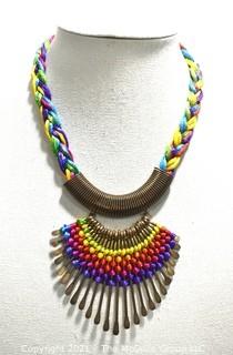 Artisan Made Hammered Brass Fringe on Multi Color Cords Necklace. Measures 21" long. 