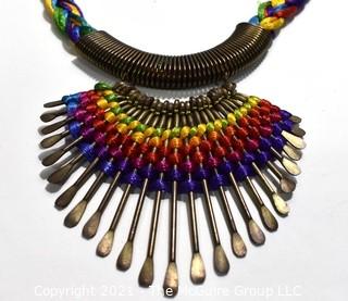 Artisan Made Hammered Brass Fringe on Multi Color Cords Necklace. Measures 21" long. 